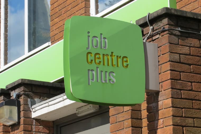 A sign that reads 'job centre plus' is shown