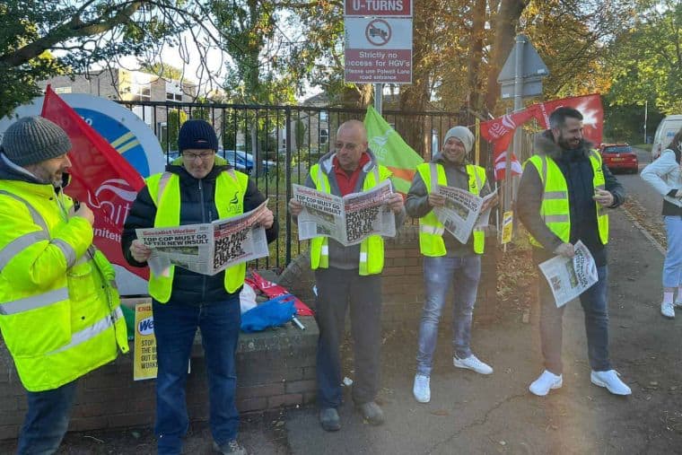 Workers reading Socialist Worker