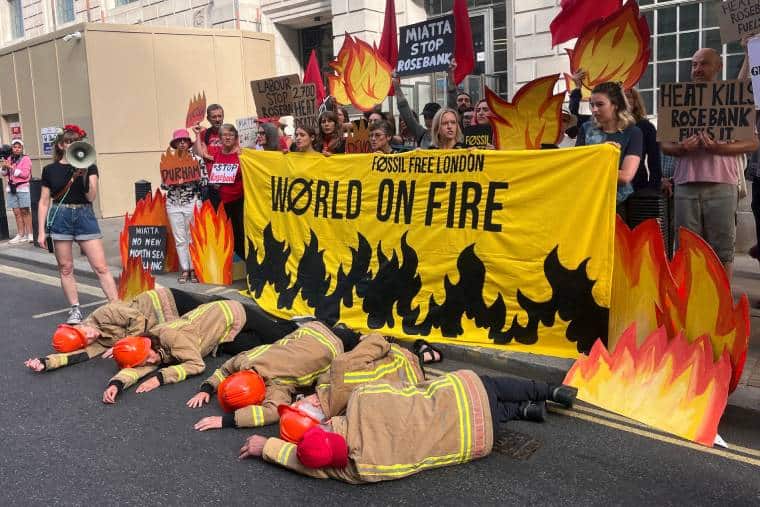 Campaigners from fossil free London demand that Andy Burnham says no to North Sea oil